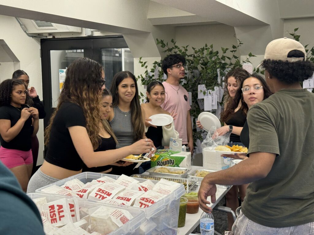 Image of students getting food at an event in RECESS